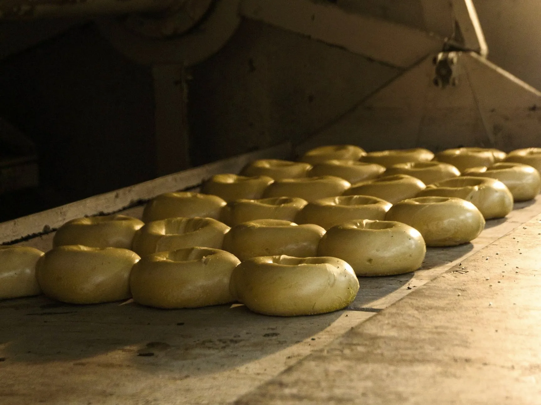 Bagels baking on the stone deck of the oven