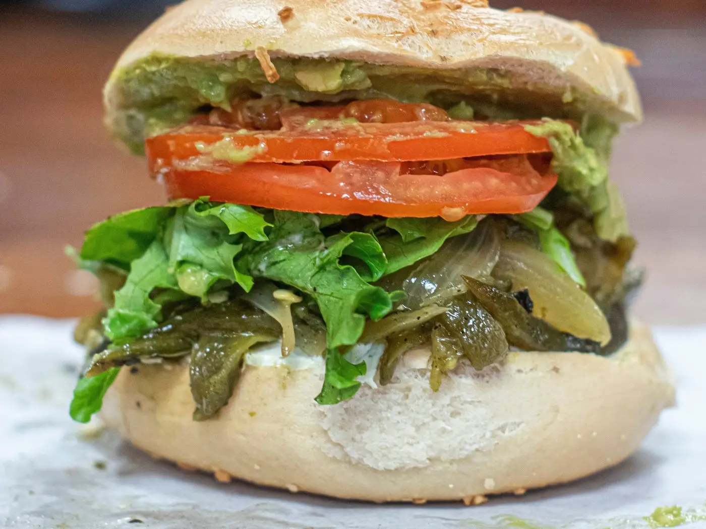 The Original "V" at Gotham Madison: vegan bagel sandwich with avocado, tomato, greens and roasted poblanos